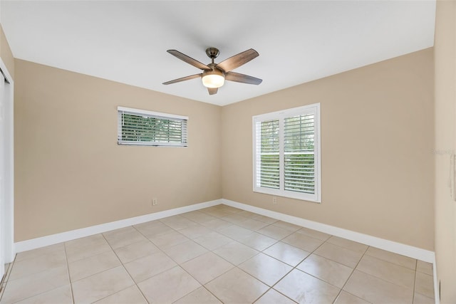 unfurnished room with light tile patterned floors and ceiling fan