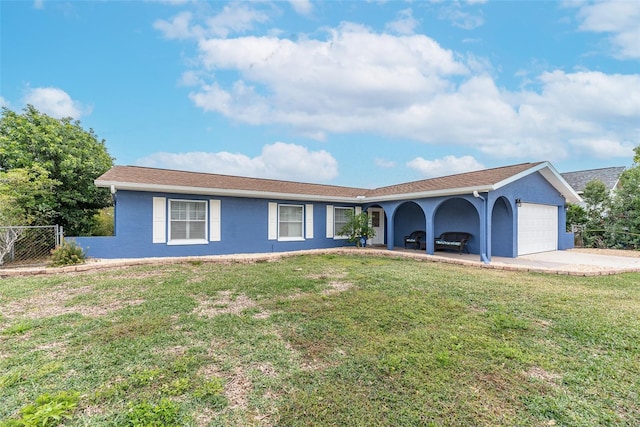 single story home featuring a carport and a front yard