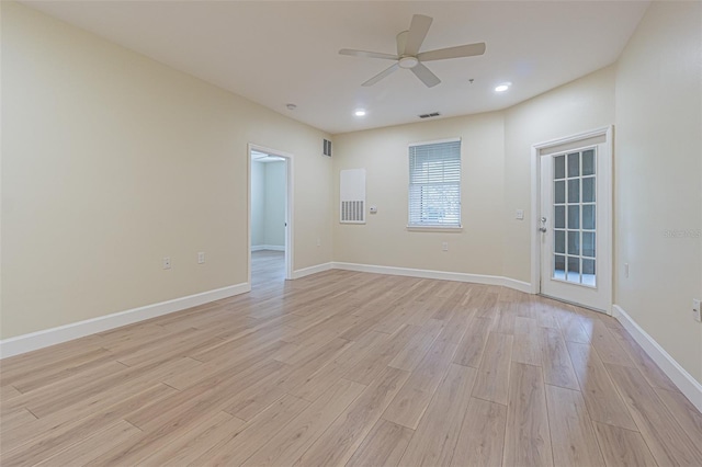 unfurnished room with light wood-type flooring and ceiling fan