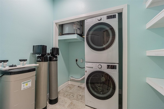 laundry area with stacked washer / dryer