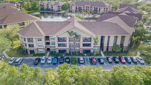 birds eye view of property with a water view