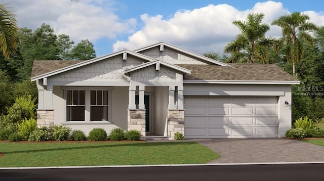 view of front of property featuring a garage and a front yard