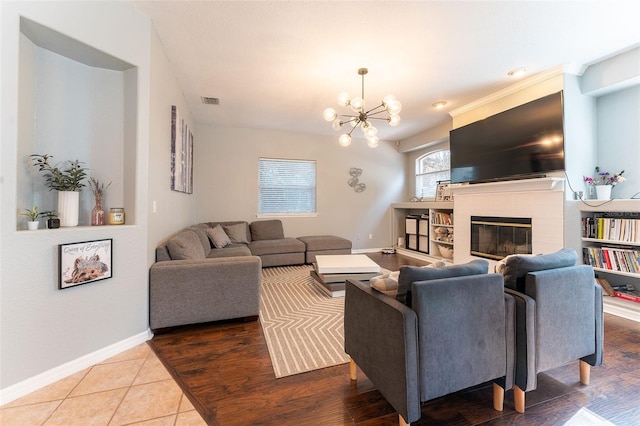 living room featuring tile patterned floors and a chandelier