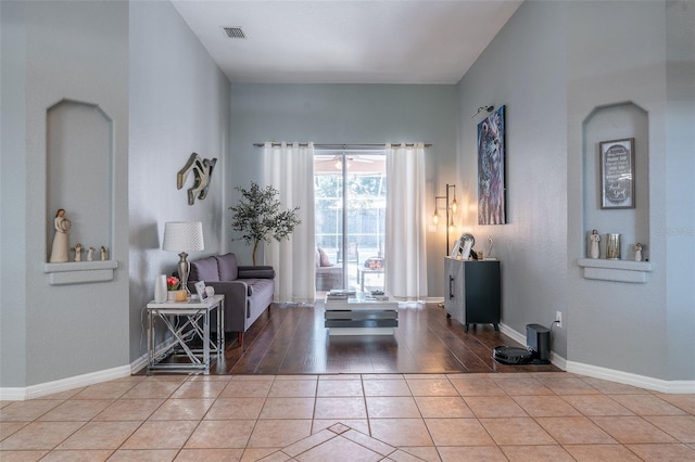 sitting room with tile patterned floors