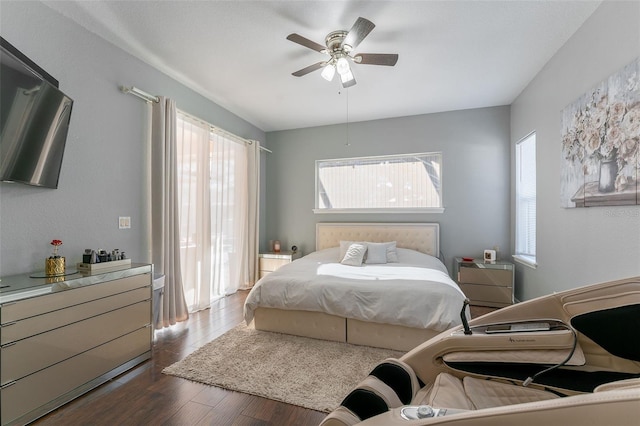 bedroom featuring ceiling fan and dark hardwood / wood-style flooring