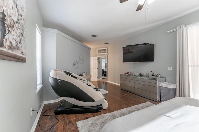 bedroom with multiple windows, dark hardwood / wood-style floors, and ceiling fan