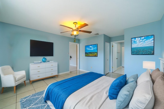 bedroom with light tile patterned floors and ceiling fan