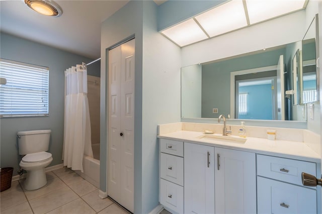 full bathroom featuring tile patterned floors, shower / tub combo with curtain, vanity, and toilet