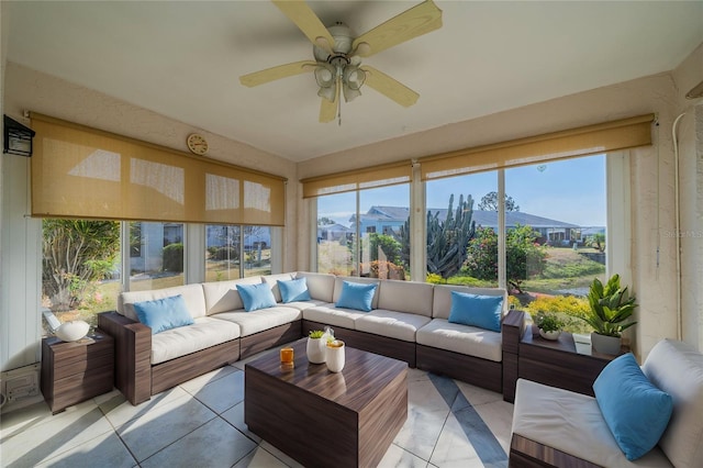 sunroom / solarium featuring ceiling fan