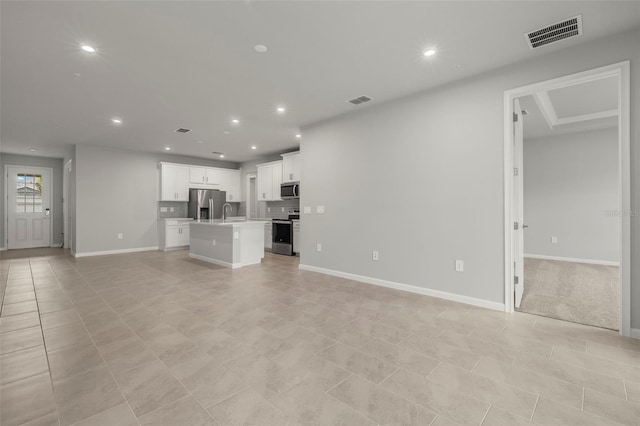 unfurnished living room with light tile patterned floors