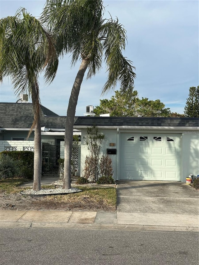 single story home featuring a garage