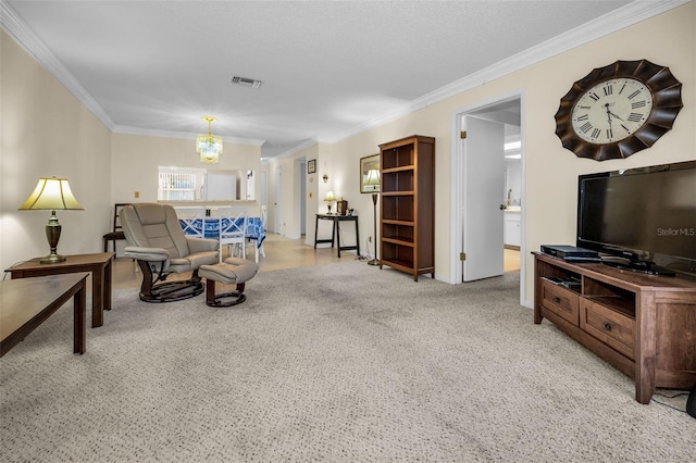 living room with a chandelier and ornamental molding