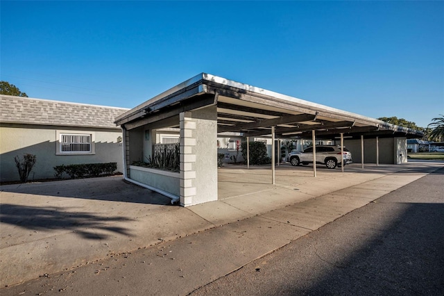 exterior space with a carport