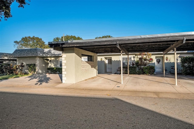 view of front of property with a carport