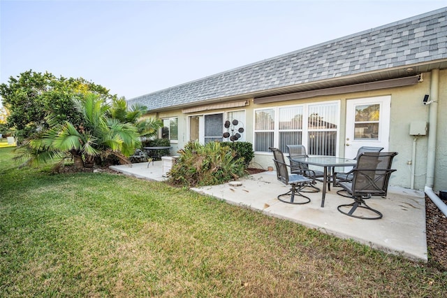 exterior space with a lawn and a patio area