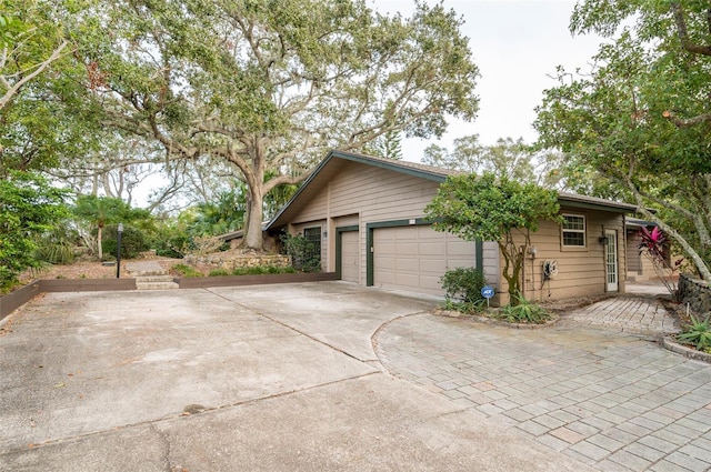 view of side of home with a garage