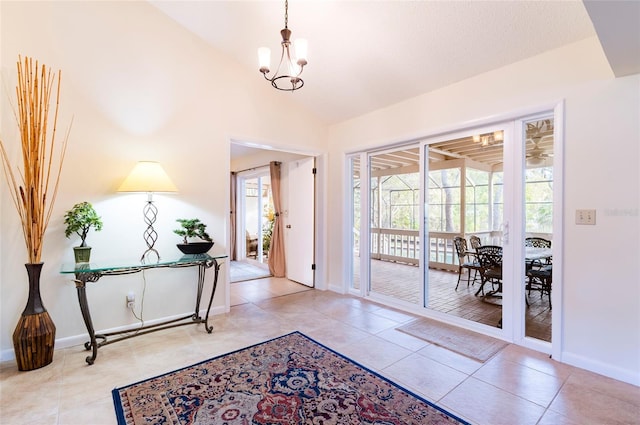 doorway featuring a chandelier and light tile patterned floors