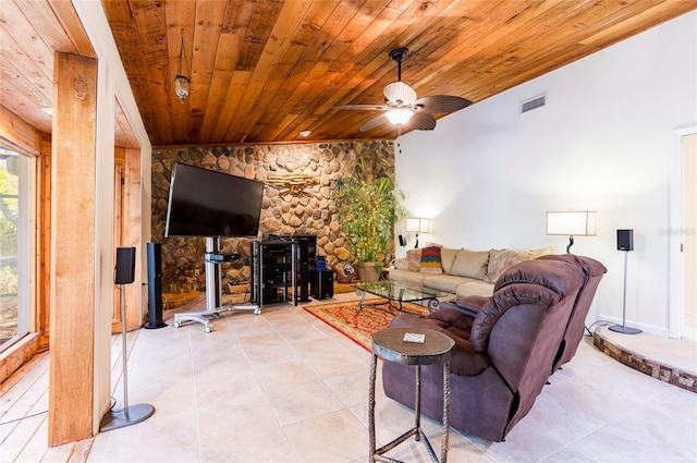 living room featuring light tile patterned floors, ceiling fan, and wood ceiling