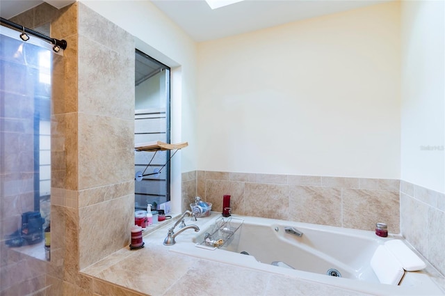 bathroom with shower with separate bathtub