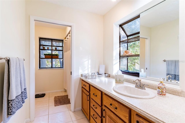 bathroom featuring tile patterned flooring and vanity