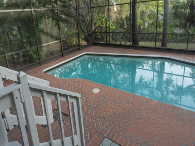 outdoor pool featuring a lanai