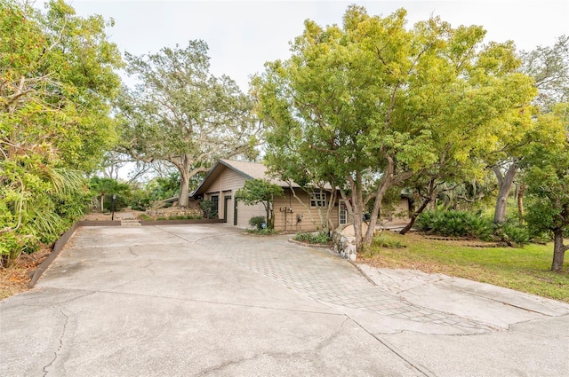 view of front of house featuring driveway and a garage