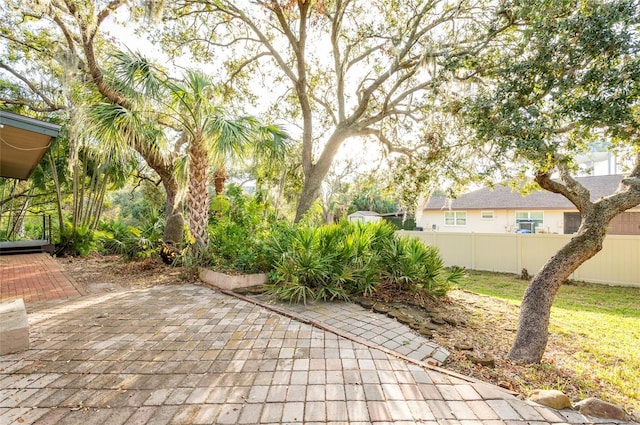 view of patio featuring fence