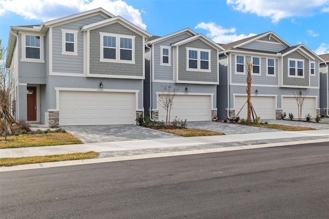 townhome / multi-family property featuring a garage