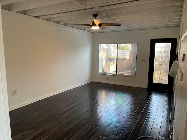 spare room featuring ceiling fan, dark hardwood / wood-style floors, and beamed ceiling