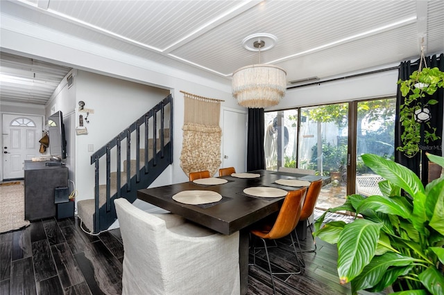 dining area featuring an inviting chandelier