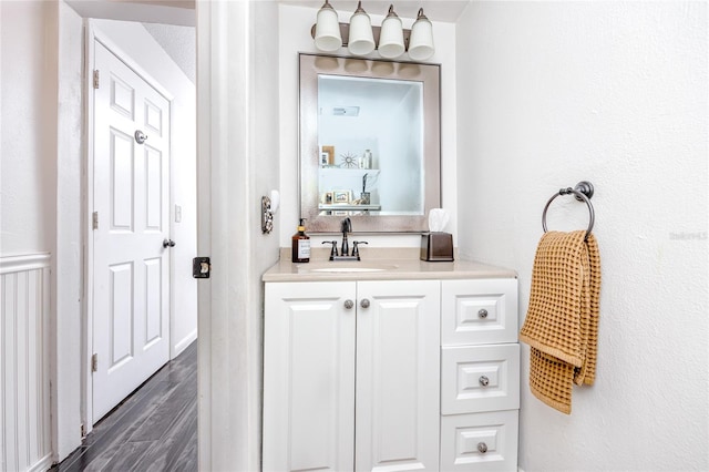 bathroom featuring vanity and hardwood / wood-style floors