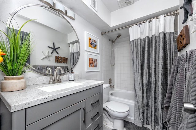 full bathroom featuring toilet, vanity, and shower / tub combo