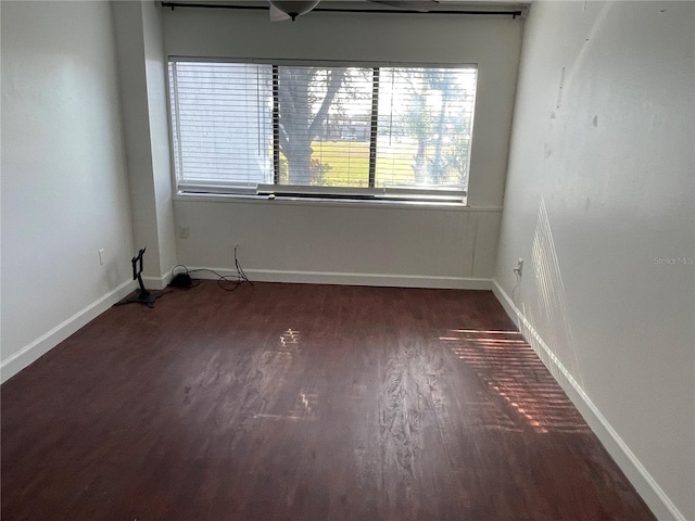 unfurnished room featuring dark hardwood / wood-style floors