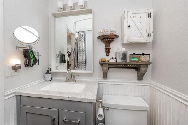 bathroom featuring toilet and vanity