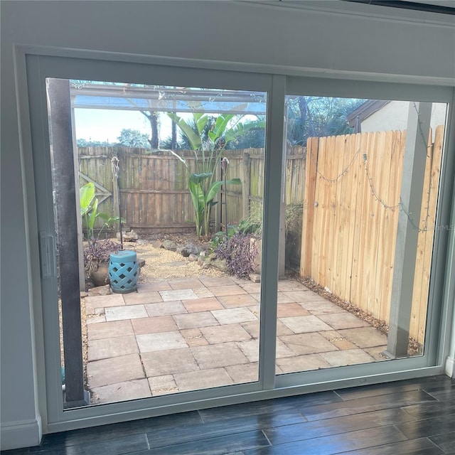 doorway to outside with hardwood / wood-style floors