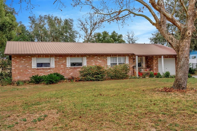 ranch-style house with a garage and a front lawn