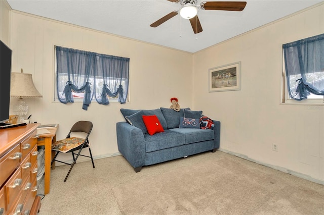 carpeted living room featuring ceiling fan