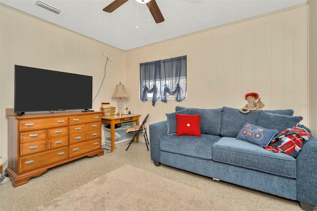 living room with carpet and ceiling fan