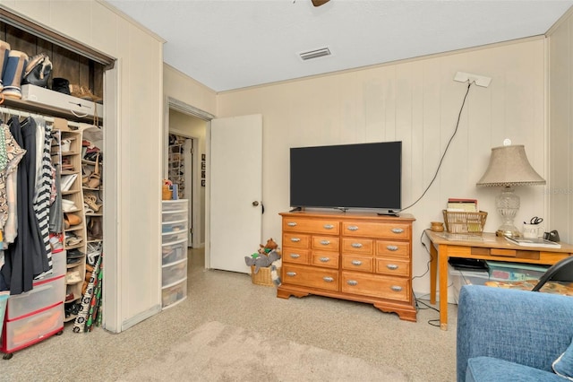 interior space featuring wood walls, a closet, and ceiling fan