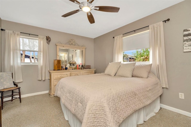 bedroom featuring ceiling fan and light carpet