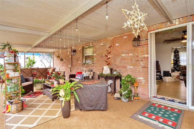 interior space with ceiling fan and beam ceiling