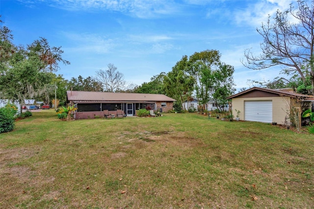 view of yard with a garage and an outdoor structure