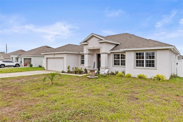 view of front of home with a garage and a front lawn