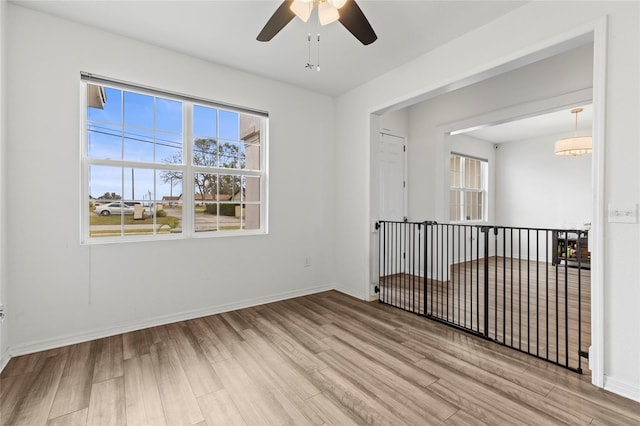 spare room featuring ceiling fan and light hardwood / wood-style flooring