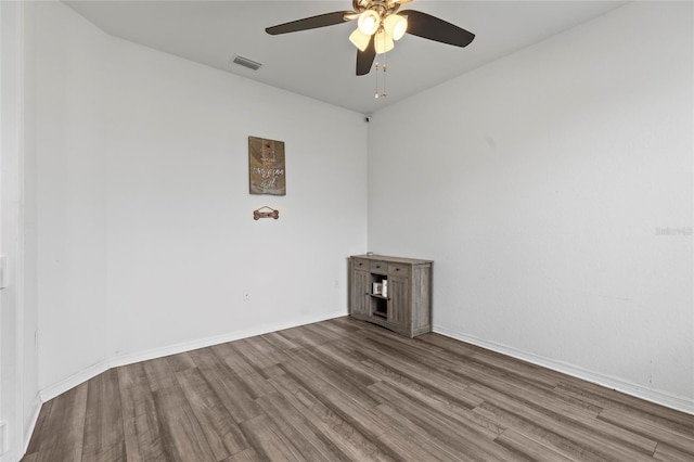 unfurnished room featuring ceiling fan and wood-type flooring