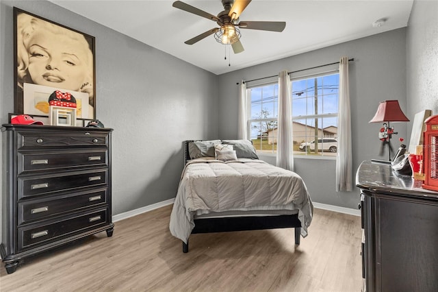 bedroom featuring ceiling fan and light wood-type flooring