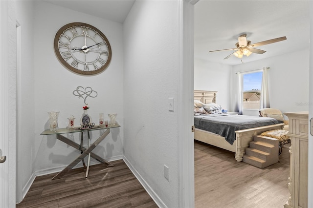 bedroom with hardwood / wood-style floors and ceiling fan