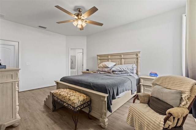 bedroom with ceiling fan and light hardwood / wood-style flooring