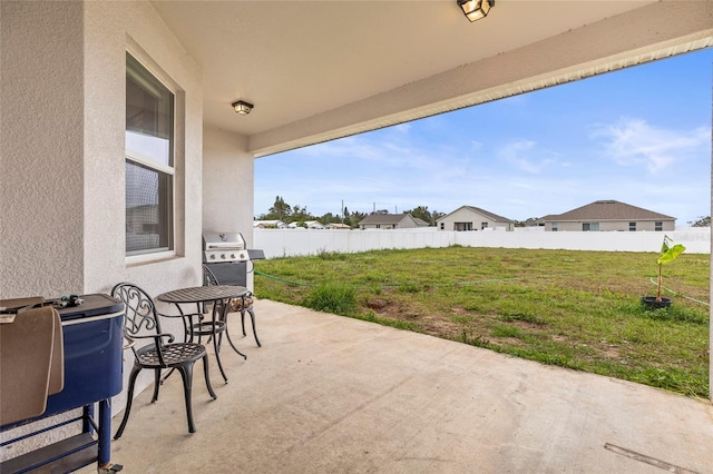 view of patio featuring a grill