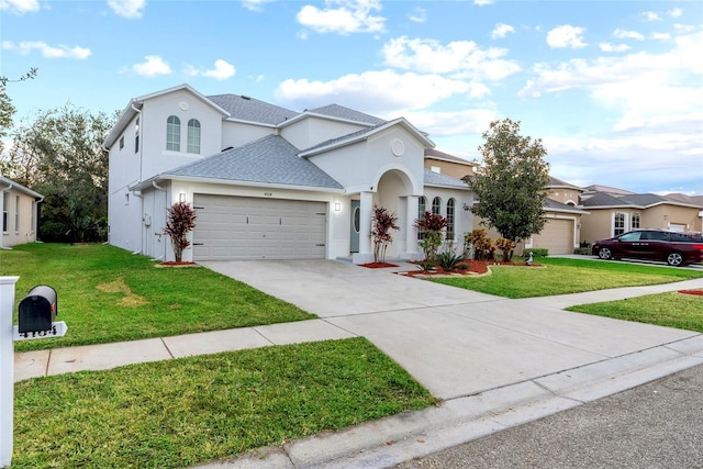 view of front property with a garage and a front yard